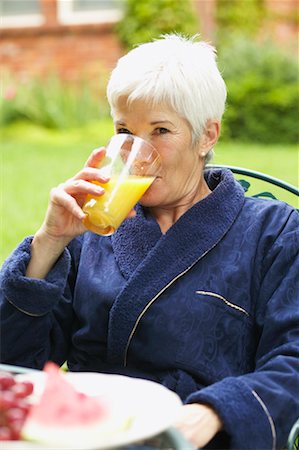 Woman Drinking Juice Outdoors Stock Photo - Rights-Managed, Code: 700-00529227