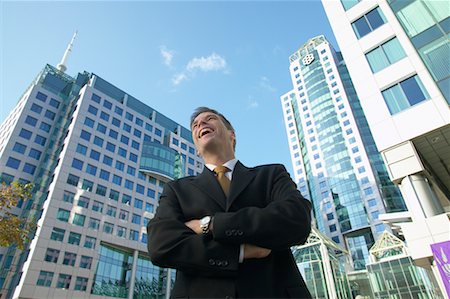 simsearch:700-00529304,k - Businessman in front of Office Towers Foto de stock - Con derechos protegidos, Código: 700-00529279