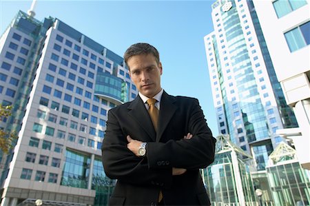 simsearch:700-00529304,k - Businessman in front of Office Towers Foto de stock - Con derechos protegidos, Código: 700-00529286