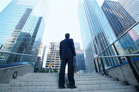 Businessman Standing on Steps Stock Photo - Rights-Managed, Code: 700-00529299