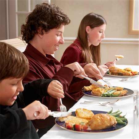 festival and chicken meal photo - Children Eating Hanukkah Dinner Stock Photo - Rights-Managed, Code: 700-00529394