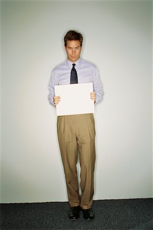 Businessman Holding Blank Card Fotografie stock - Rights-Managed, Codice: 700-00529555