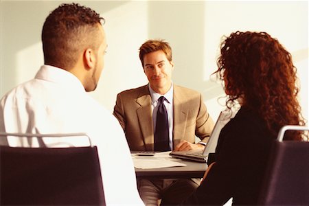 financial advisor talking to couple - Financial Advisor Meeting with Young Couple Stock Photo - Rights-Managed, Code: 700-00529574