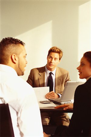 financial advisor talking to couple - Financial Advisor Meeting with Young Couple Stock Photo - Rights-Managed, Code: 700-00529576