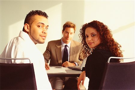 financial advisor talking to couple - Young Couple Meeting with Financial Advisor Foto de stock - Con derechos protegidos, Código: 700-00529573