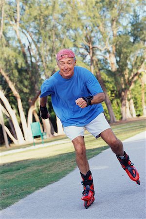 path to retirement and conceptual - Man Rollerblading Stock Photo - Rights-Managed, Code: 700-00529740