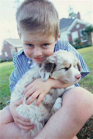 simsearch:700-00350535,k - Young Boy with Puppy Foto de stock - Direito Controlado, Número: 700-00529750