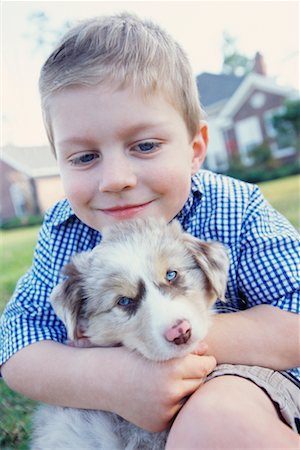 simsearch:700-00350535,k - Young Boy with Puppy Foto de stock - Direito Controlado, Número: 700-00529751