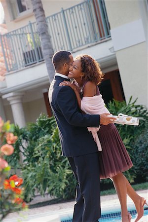 formal pool backyards - Couple in Formal Wear, Man Holding Gift Stock Photo - Rights-Managed, Code: 700-00529942