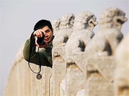 summer palace - Man Taking Picture on 17 Arch Bridge at Summer Palace, Beijing, China Foto de stock - Con derechos protegidos, Código: 700-00520899