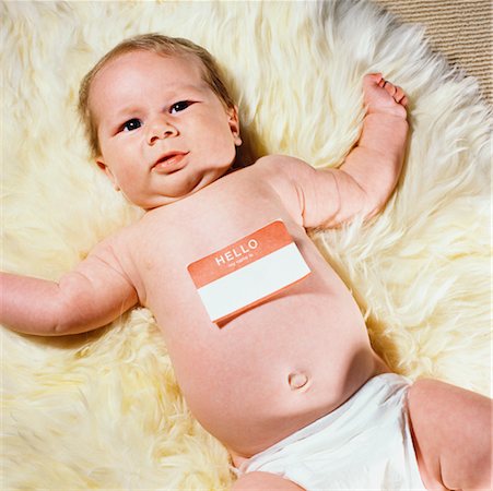 diaper for little girl - Portrait of Baby Wearing Name Tag Foto de stock - Con derechos protegidos, Código: 700-00521014