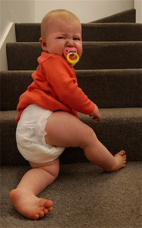 fussy baby - Baby Sitting on Stairs Stock Photo - Rights-Managed, Code: 700-00521157