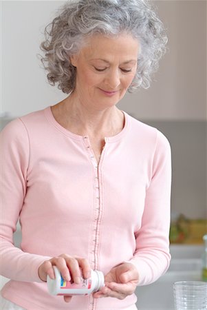 Woman Taking Pills Stock Photo - Rights-Managed, Code: 700-00521474