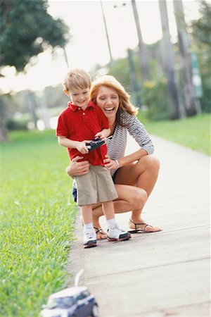 Mother and Son with Remote Control Car Stock Photo - Rights-Managed, Code: 700-00522364