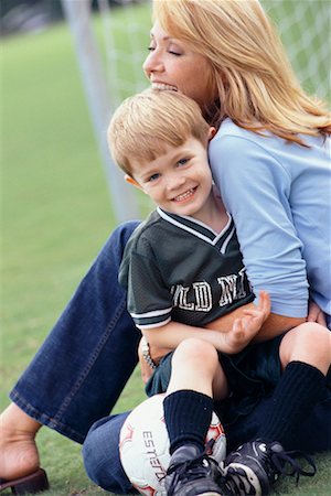 soccer boys sit on the ball - Mother with Son at Soccer Game Stock Photo - Rights-Managed, Code: 700-00522361