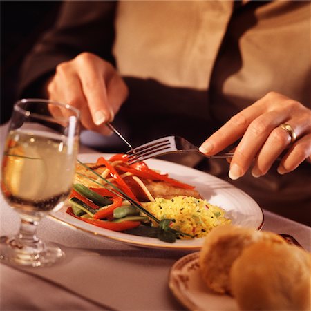 simsearch:628-01712063,k - Close Up of Woman Eating Dinner Stock Photo - Rights-Managed, Code: 700-00522504