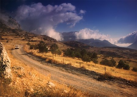 Car Driving on Dirt Road, Greece Stock Photo - Rights-Managed, Code: 700-00522502