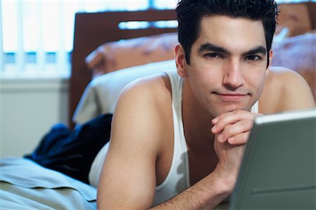 Man Using Laptop Computer In Bed Stock Photo - Rights-Managed, Code: 700-00522929