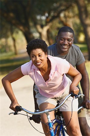 riding a tandem bike - Couple Riding Tandem Bicycle Stock Photo - Rights-Managed, Code: 700-00523339
