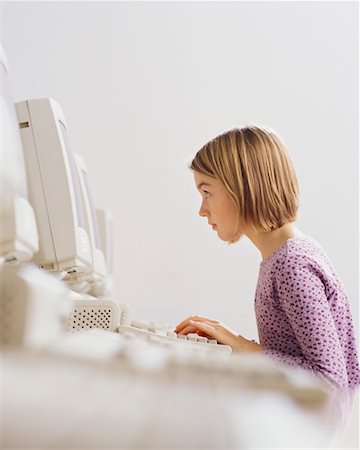 preteen girl eyebrows raised - Student Using Computer in Classroom Stock Photo - Rights-Managed, Code: 700-00523446