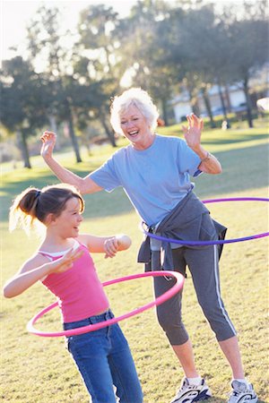 Grandmother and Granddaughter Using Hula Hoops Outdoors Stock Photo - Rights-Managed, Code: 700-00523490