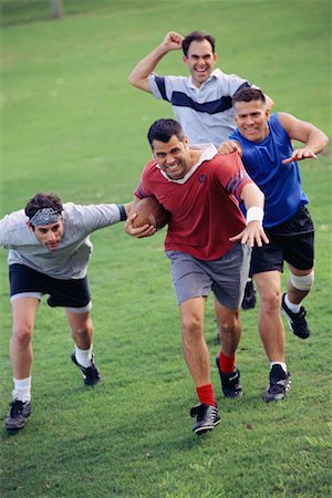 friends playing football - Men Playing Football Stock Photo - Rights-Managed, Code: 700-00523704