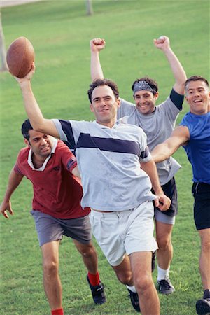 friends playing football - Men Playing Football Stock Photo - Rights-Managed, Code: 700-00523705