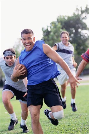 simsearch:700-00523720,k - Men Playing Football Stock Photo - Rights-Managed, Code: 700-00523703