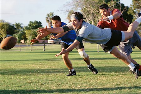 friends playing football - Men Playing Football Stock Photo - Rights-Managed, Code: 700-00523716