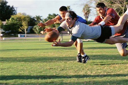 Men Playing Football Foto de stock - Con derechos protegidos, Código: 700-00523717