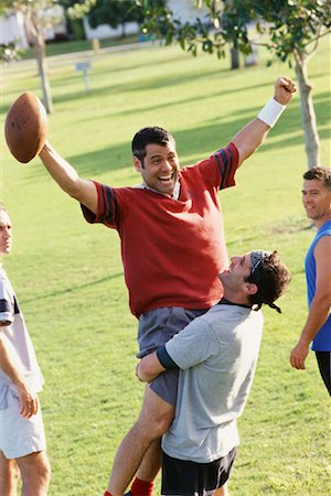 friends playing football - Men Playing Football Foto de stock - Con derechos protegidos, Código: 700-00523713