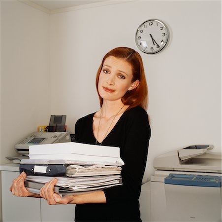 stressful women at the office with piles of work - Businesswoman Looking Stressed Stock Photo - Rights-Managed, Code: 700-00523733
