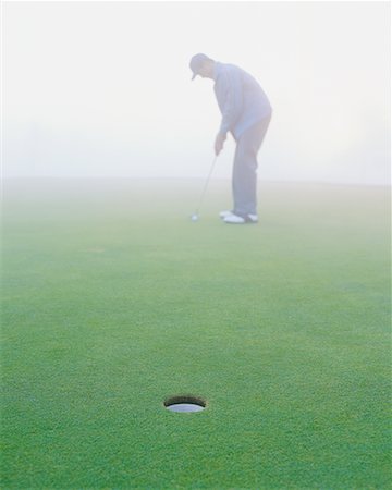 Golfer on Putting Green Stock Photo - Rights-Managed, Code: 700-00523807