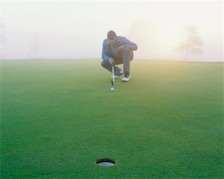 simsearch:6113-07159291,k - Golfer on Putting Green Stock Photo - Rights-Managed, Code: 700-00523808