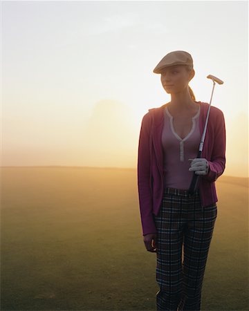 Backlit Woman on Golf Course Stock Photo - Rights-Managed, Code: 700-00523820