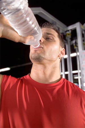 satisfied (thirst) - Man Drinking Water Foto de stock - Con derechos protegidos, Código: 700-00530590