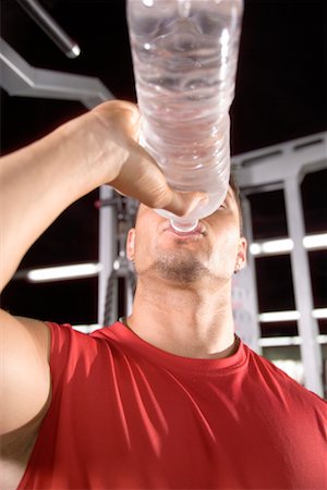 satisfied (thirst) - Man Drinking Water Foto de stock - Con derechos protegidos, Código: 700-00530591