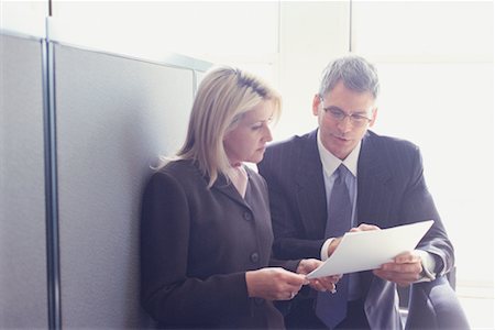 Business People Looking at Paperwork Stock Photo - Rights-Managed, Code: 700-00530635