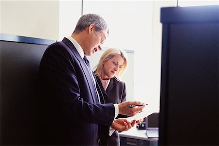 Business People Looking at Paperwork Stock Photo - Rights-Managed, Code: 700-00530633