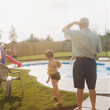 swim water wing - Grandfather and Granddaughter by Pool Stock Photo - Rights-Managed, Code: 700-00530694