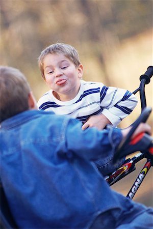 siblings conflict - Boy Sticking Out Tongue at Brother Stock Photo - Rights-Managed, Code: 700-00544017