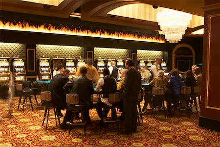people sitting in casino - People Gambling in Casino Stock Photo - Rights-Managed, Code: 700-00544143