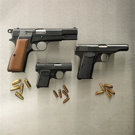 Trois armes de poing avec balles Photographie de stock - Rights-Managed, Code: 700-00544154