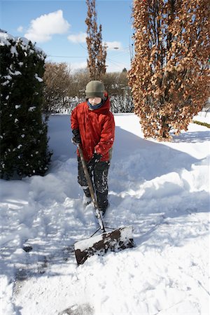 Boy Shovelling Snow Stock Photo - Rights-Managed, Code: 700-00544158