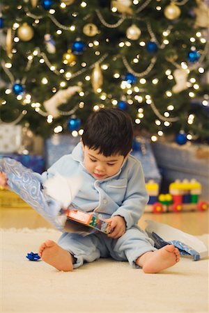 Boy Opening Gift on Christmas Morning Stock Photo - Rights-Managed, Code: 700-00544365