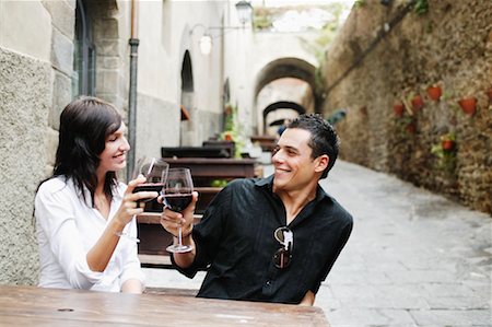 restaurants in tuscany italy - Couple Toasting Outdoors Stock Photo - Rights-Managed, Code: 700-00544422