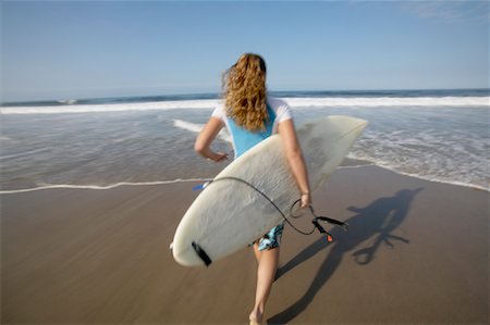 simsearch:700-01587339,k - Woman Running on Beach with Surfboard Fotografie stock - Rights-Managed, Codice: 700-00546176