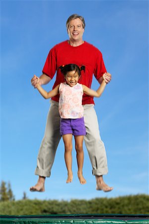 Père et fille sur le Trampoline Photographie de stock - Rights-Managed, Code: 700-00546453