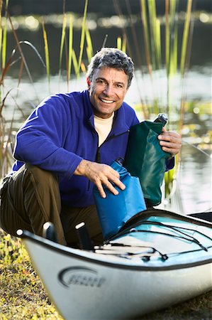 Man Packing Kayak Stock Photo - Rights-Managed, Code: 700-00546654