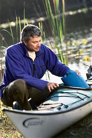 people portaging boats - Man Packing Kayak Stock Photo - Rights-Managed, Code: 700-00546657